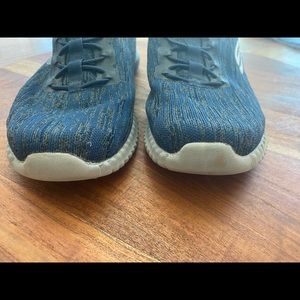 Well cared for men’s comfy, knit fabric sneakers.